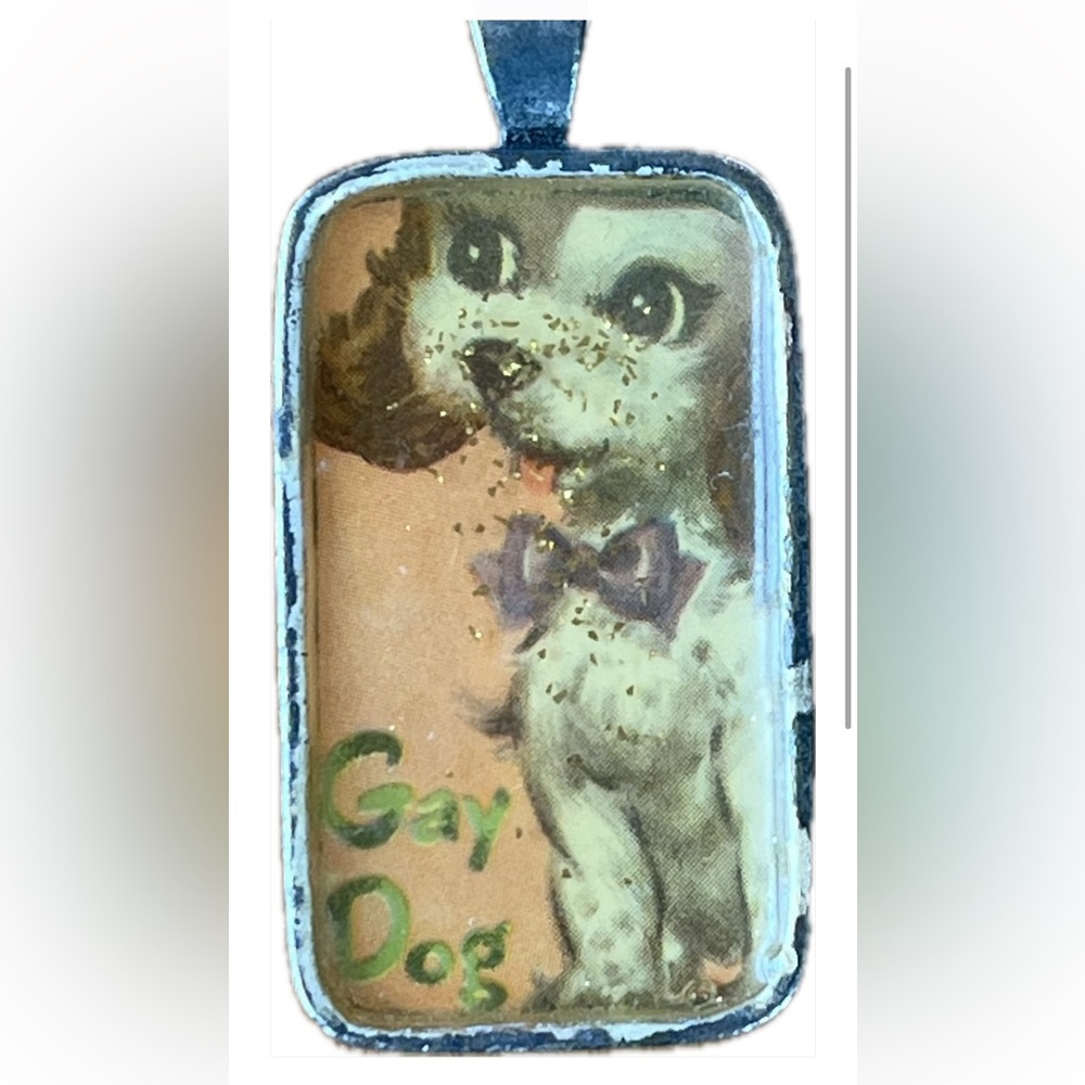 Charming pendant with vintage Gay Dog pic. Epoxy filled with sparkles. Silver.